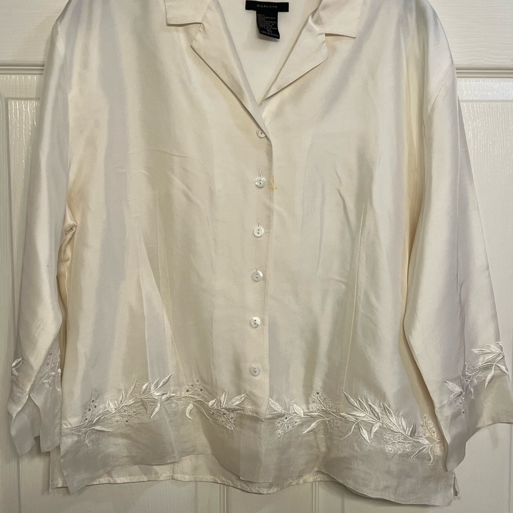 Pure silk top with beautiful embroidery accent at bottom.